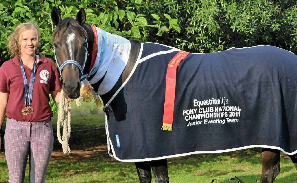 Selena Madsen, her horse All Bling and their rug for a junior eventing win at the nationals. 